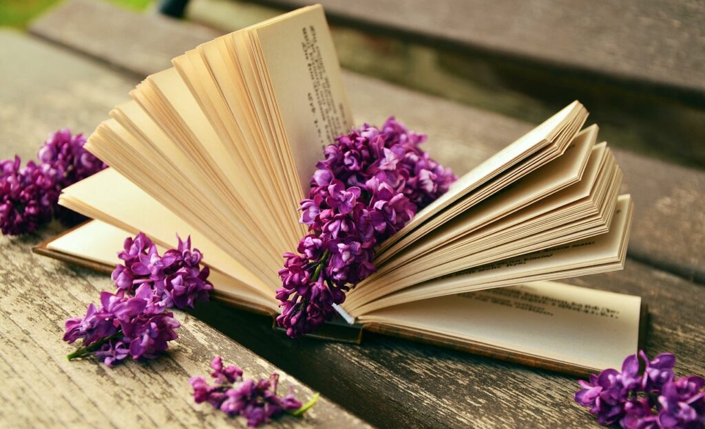 Historical fiction book with purple flowers.
